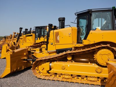 row of bulldozers in a construction site 1
